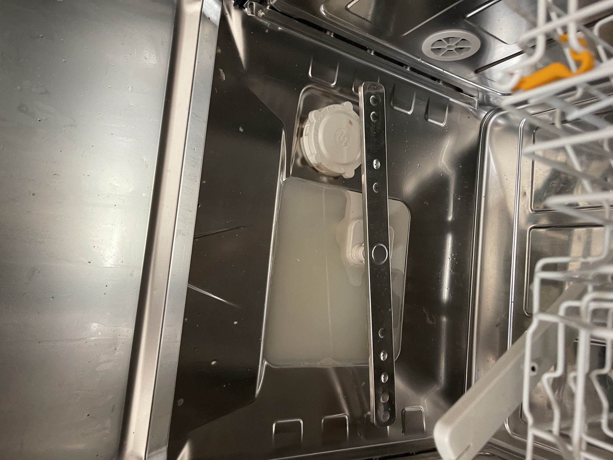 An internal dishwasher blockage at the drain pump.