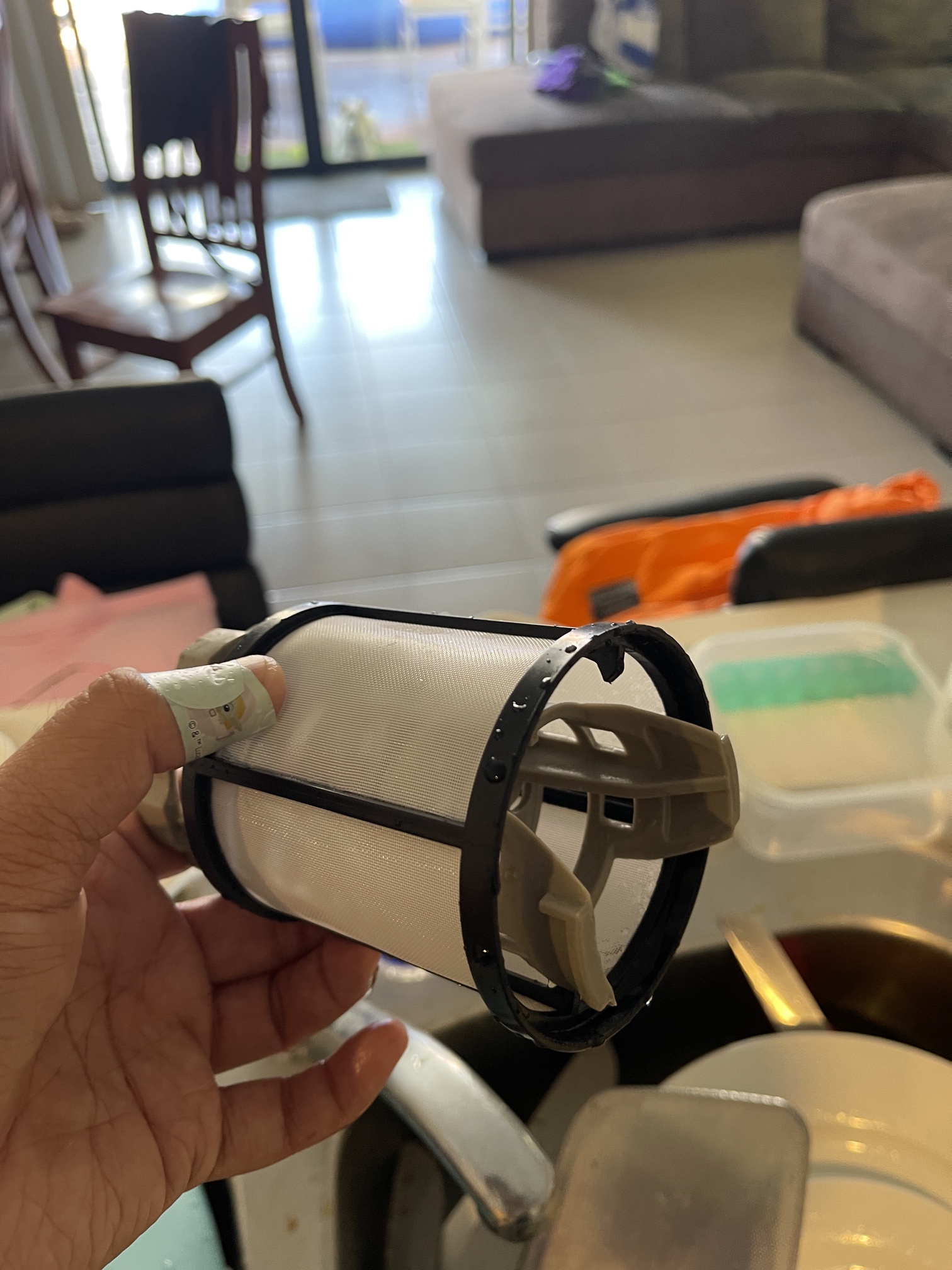 A second example of a dishwasher filter after Encore Service cleaning.