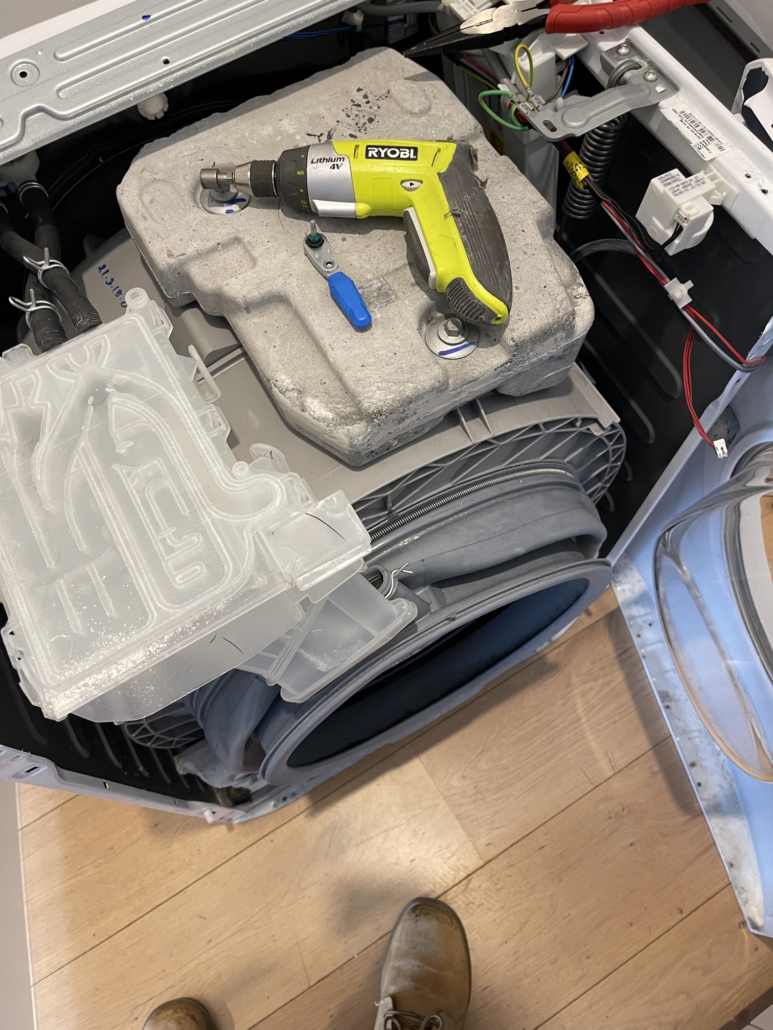 A washing-machine door seal mid-replacement.